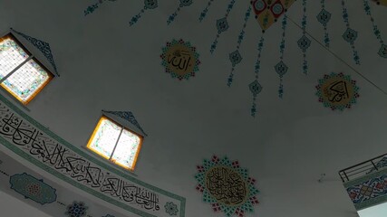 Interior view of a mosque dome designed in traditional Turkish Ottoman style, featuring elegant patterns and Islamic architectural details. Suitable for religious, cultural, and architectural concepts