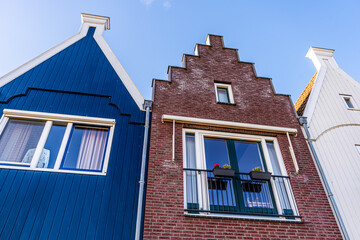 Old window Dutch roofs Volendam Netherlands classic Colorful houses village. Old Holland wooden architecture
