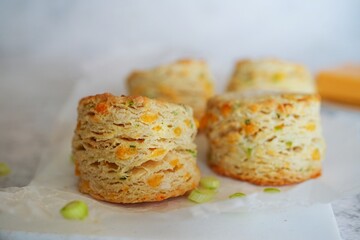 Homemade cheddar buttermilk biscuits with scallions, selective focus