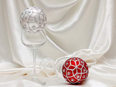 Red and silver Christmas balls with satin cloth background