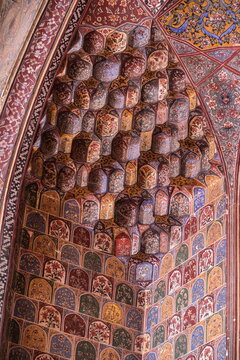 View of a decorative architectural feature with multiple small, colorful geometric shapes creating a textured surface, Lahore, Punjab, Pakistan.