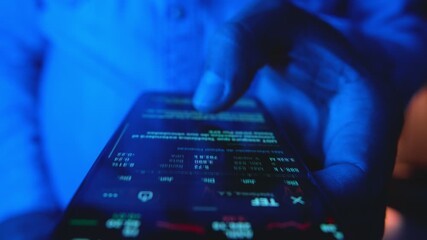 Closeup of a trader analyzing stock market data and financial charts on a mobile phone display - Powered by Adobe