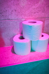 Toilet paper rolls in the bathroom, shallow depth of field and selective focus.