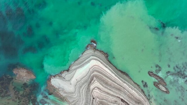 Scala dei Turchi, or the Turkish stairs in Sicily, Italy. Aerial Drone Shot. Unique White Rocks and Turquoise water.