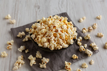 Homemade Salty Popcorn in a Bowl, side view.