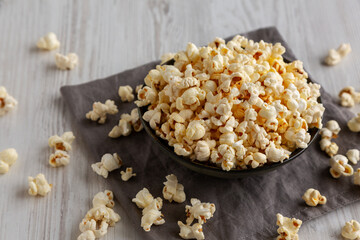 Homemade Salty Popcorn in a Bowl, side view.