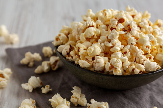 Homemade Salty Popcorn in a Bowl, low angle view.