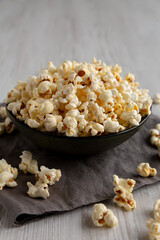 Homemade Salty Popcorn in a Bowl, low angle view. Close-up.