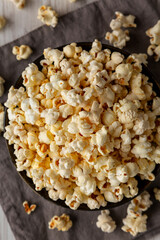 Homemade Salty Popcorn in a Bowl, top view. Flat lay, overhead, from above. Close-up.