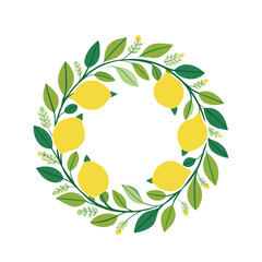 A circular frame with fresh lemons and  green leaves