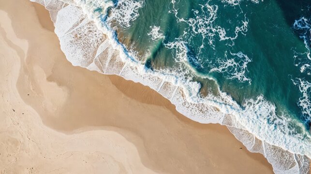 Aerial view of ocean waves meeting pristine sandy beach, showcasing dynamic tide patterns. Use: travel brochure cover, environmental documentary.