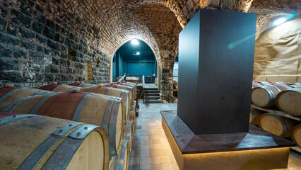 Rustic Wine Cellar with Wooden Barrels © M