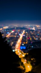 Generative AI vibrant cityscape at night with illuminated roads and blurred lights showcasing