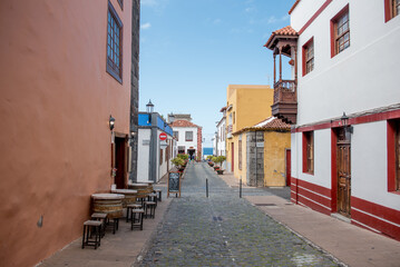Garachico, Tenerife, Spain, A picturesque alleyway lined with traditional houses and vibrant plants, inviting exploration in Garachico