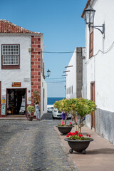 Garachico, Tenerife, Spain: An inviting corner in Garachico featuring colorful facades and lush greenery, perfect for leisurely strolls