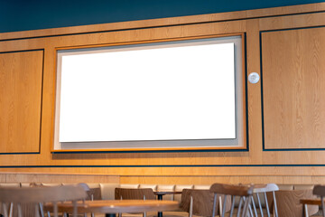 Blank screen mockup on modern wooden wall in a stylish coffee shop, Empty advertising billboard...