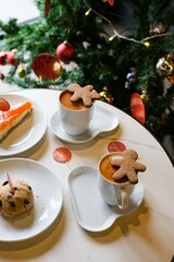 Holiday treats and hot drinks with Christmas decor