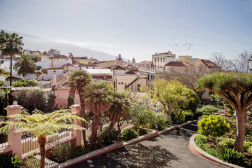 La Orotava, Tenerife, Spain 03.06.2018: Vibrant garden in La Orotava, Tenerife, featuring tropical plants and a pathway leading through lush greenery