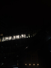 Modern Office Building Windows at Night with Interior Lights, Dark Urban Architecture and Minimal Corporate Atmosphere