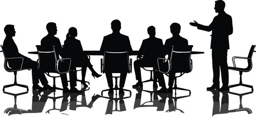 Business meeting silhouette with presenter speaking to seated team around conference table in corporate setting