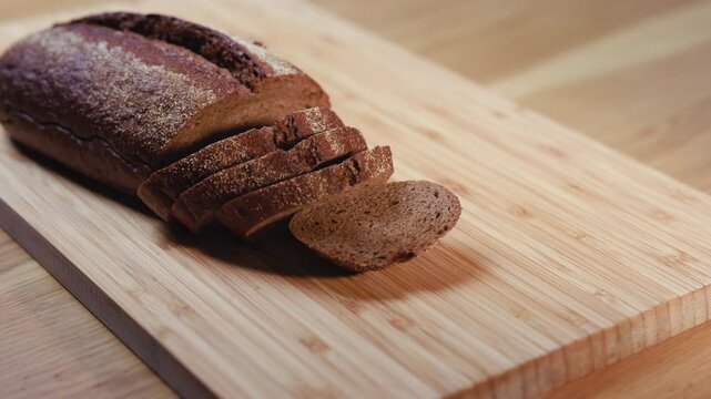 Sliced Loaf Arranged On Board Hands Cutting Neat Rows Rustic Deli Prep For Sandwiches And Serving . Media