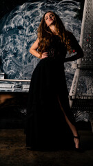 The girl in a delicate black dress near the tower of the elf.