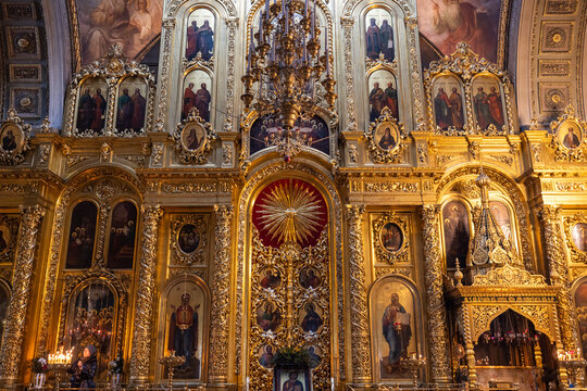 View of gilded icons and ornate carvings gleam under soft candlelight, painting a scene of reverence and antiquity, Moskva, Moskva, Russia.