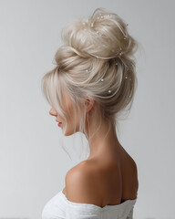 Fototapeta premium Close-up of elegant blonde updo hairstyle with decorative hairpins