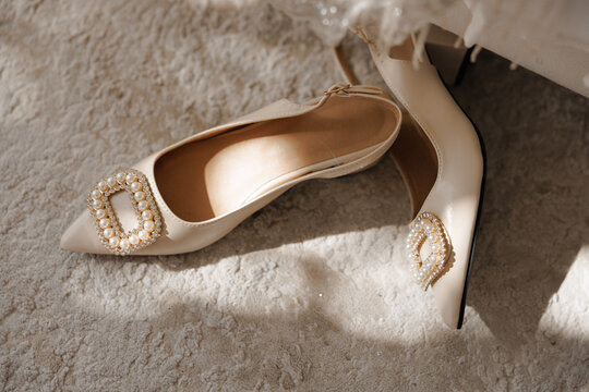 Chic bridal footwear adorned with crystals on luxurious carpet setting - Powered by Adobe
