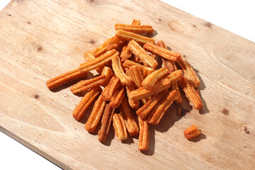 French fries snack on a wooden board, isolated on white background
