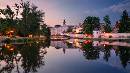 Ceske Budejovice, Czech Republic. Cityscape image of downtown Ceske Budejovice, Czech Republic with reflection of the city in the Malse River at summer sunset.	