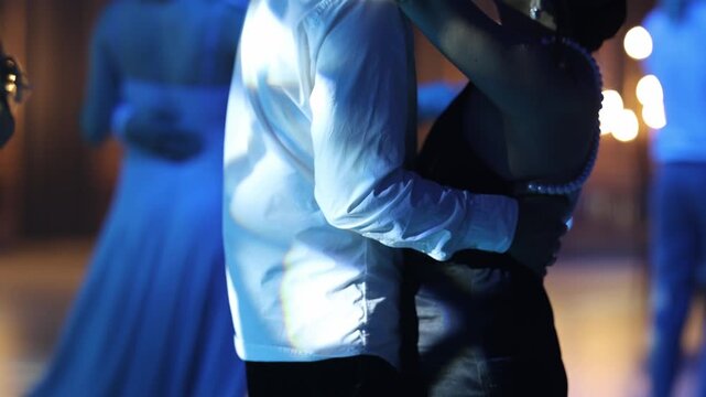 Pair of individuals sway gently amid warm romantic atmosphere
