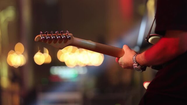Guitar play closeup, Intimate live guitar performance with mood lighting