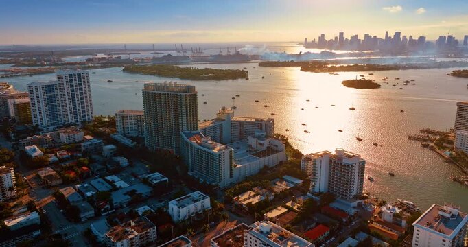 Scenic view on Brickel Key, Miami, Florida at sunset. Smoke from a pipe spreads over the panorama. Aerial perspective.