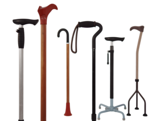 A collection of various walking canes including quad canes and adjustable models for mobility support