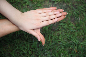 Two hands are clasped together in a prayer position. Concept of peace and spirituality