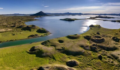 view of the Skutustadagigar pseudo craters and Myvatn Lake in northern Iceland in high summer