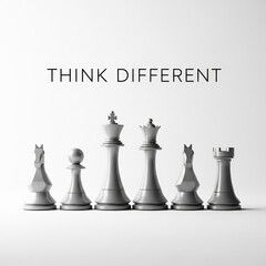 Chess pieces arranged in a row with the words think different isolated on white background