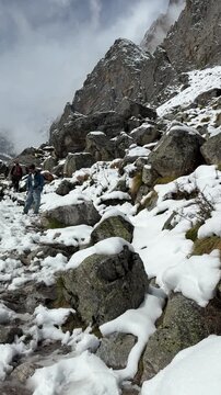 Breathtaking view of the Chaukhamba mountain range covered in winter snow 4K.