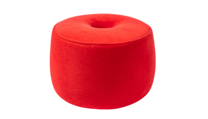 Vibrant red, donut-shaped, velvety stool. It has a round hole in the top. Against black backdrop