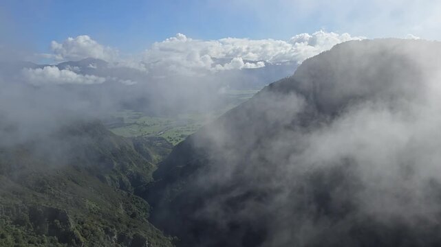 Fog Rises towards the Mountains on a Sunny Day, New Zealand