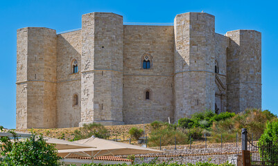 Castel del Monte, a unique octagonal fortress and castle in Apulia, Italy, under a clear blue sky....