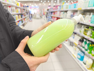 Choosing washing powder ,detergent,liquids at Groceries.