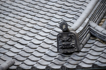 This Japanese traditional Onigawara features a fierce guardian face believed to ward off evil spirits