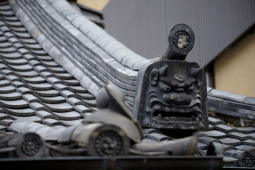 The Onigawara sits proudly on the roof ridge, showcasing intricate Japanese craftsmanship