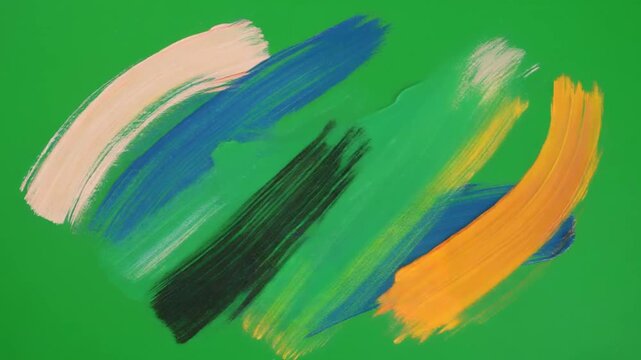 Large, bold paintbrush strokes sweep across the green screen