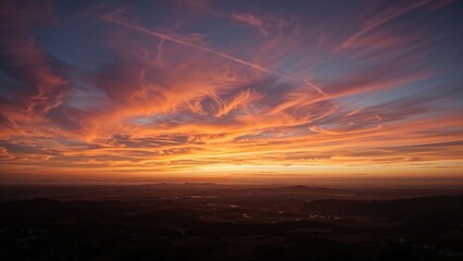 Vivid sunset sky with colorful clouds and a horizon view, showcasing a stunning natural landscape and atmospheric effects.