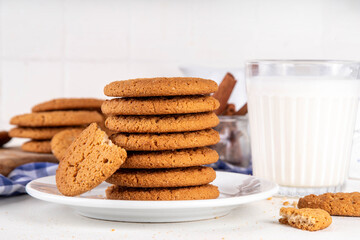 Homemade golden-brown Gingersnap Cookies stack on kitchen table. Traditional american ginger snap cracked biscuit cookies, with milk glass, copy space