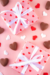 Romantic Valentine day background with hearts, gift boxes, heart-shaped chocolates. St Valentine’s day dating menu for restaurant, cafes, party invitation background copy space