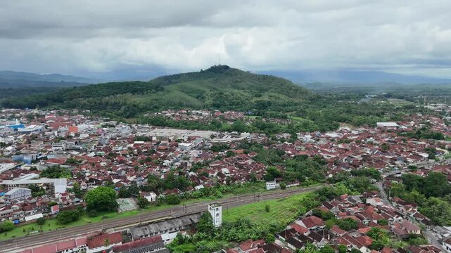 Drone footage of residential areas with a hilly background in Banjar City, West Java, Indonesia